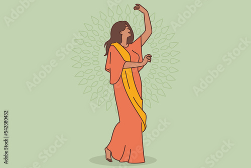 Happy woman in indian clothing dancing