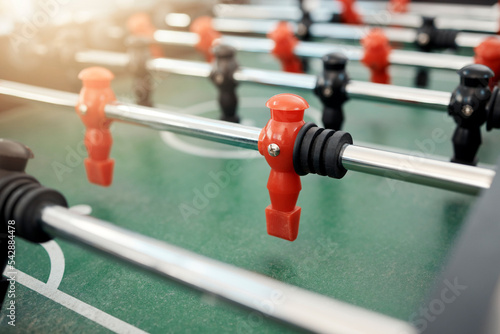 Foosball, game and table for entertainment, fun and team activity with artificial toy or players in zoom. Plastic, arcade and games for competition, competitive and miniature football or soccer field