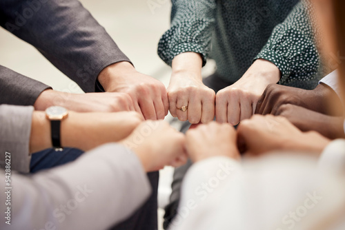 Fist bump, office teamwork and diversity of hands together for business and team support. Team building, community and collaboration success hand sign of company worker staff group about to work