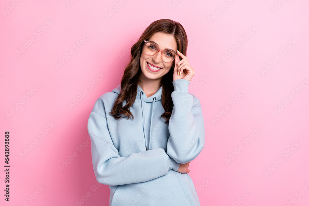 Photo of cheerful nice smart lady beaming smile hand touch glasses isolated on pink color background Photo of cheerful nice smart lady beaming smile hand touch glasses isolated on pink color background