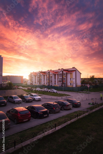 Beautiful sunset in the sky over the building of the suburbs. Yekaterinburg, Michurinsky district