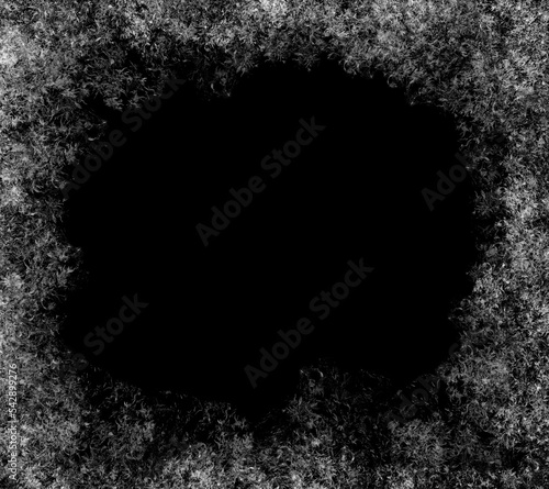 A frame of a frosty pattern  on a black background. A frame with an abstract ice structure allows you to apply or add a frost effect. Frost on the glass, freezing effect photo