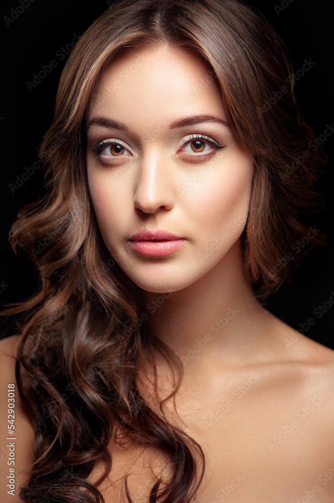 Fototapeta premium Beautiful young woman looking at camera