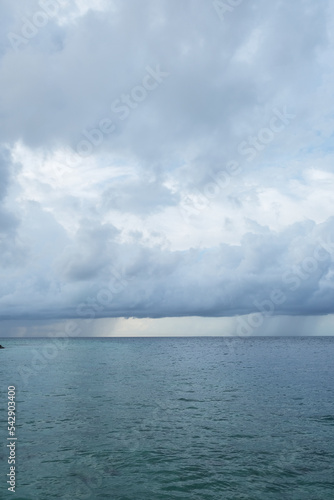 The monsoon season of Rasdhoo, with heavy gray cloud and rain, Maldives.