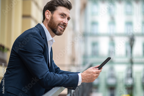 Young businessman with a tablet in hands having a video call