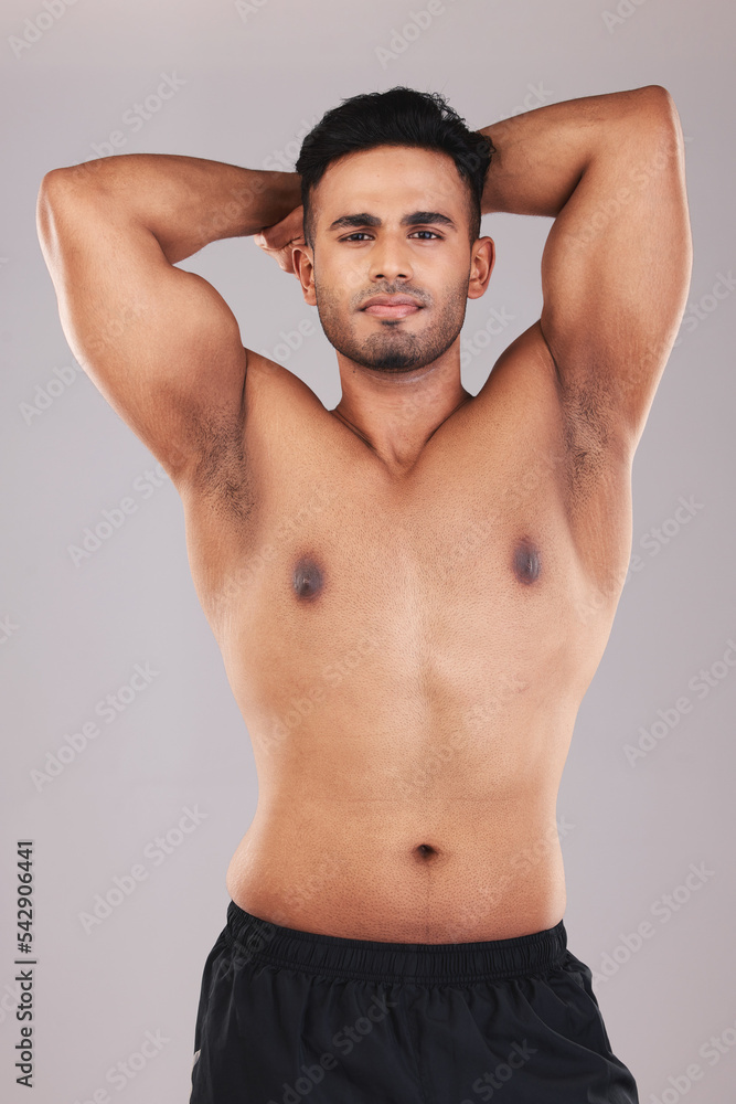 Fitness, muscle and sport man showing body after exercise, training and workout for health, wellness and power. Portrait of indian bodybuilder male model with motivation for fit and healthy lifestyle Fitness, muscle and sport man showing body after exercise, training and workout for health, wellness and power. Portrait of indian bodybuilder male model with motivation for fit and healthy lifestyle