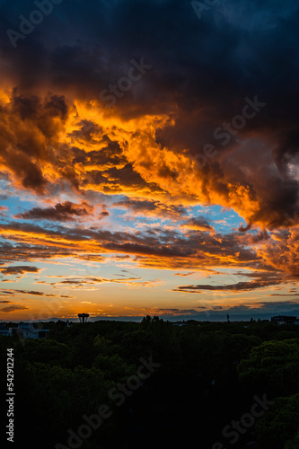 Games of clouds in a fiery sunset. The sky above Lignano Sabbiadoro