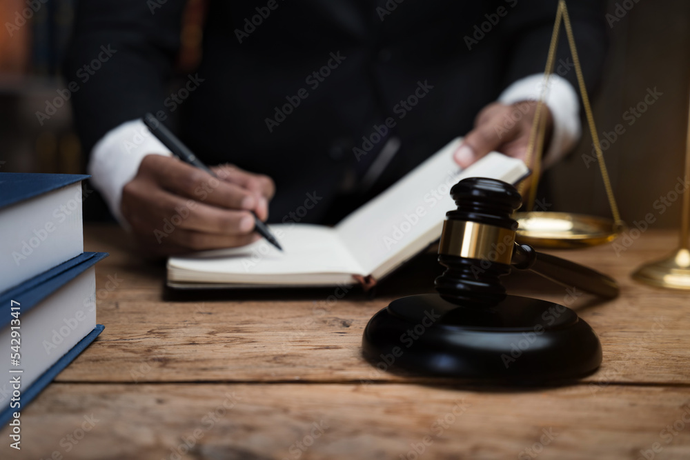 Lawyer businessman working in office. Businessmen sitting at desk and making notes. Lawyer businessman working in office. Businessmen sitting at desk and making notes.