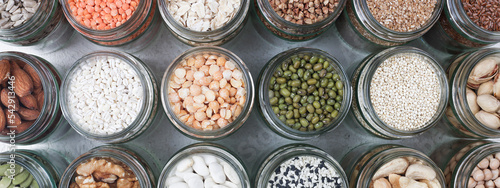 Vegan protein source. healthy vegetarian food. top view of seeds, nuts, pea, lentils spelt, bean, oatmeal on white background banner