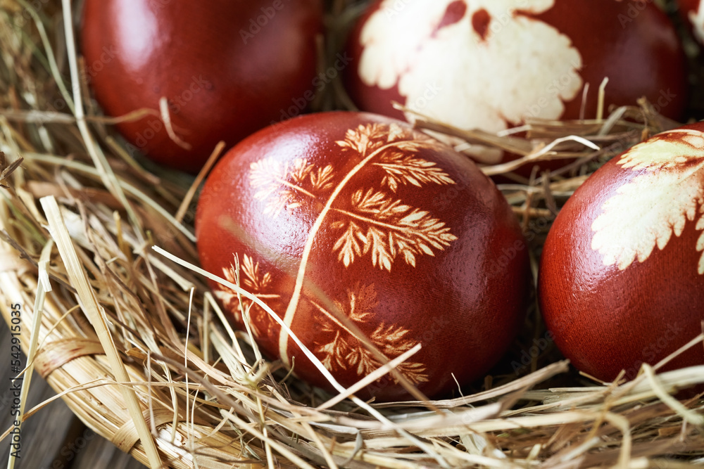 Easter eggs dyed with onion skins in a wicker basket