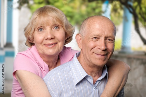 Senior happy couple hugging at home