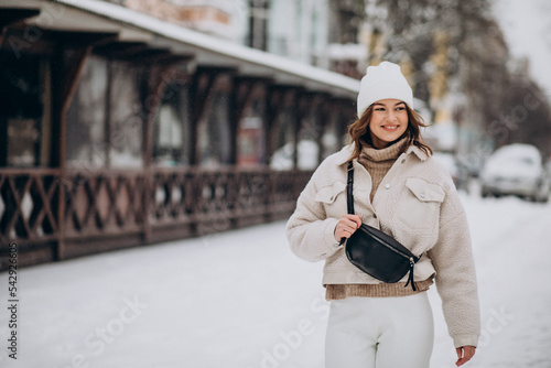 Young woman in winter outfit outside the street photo