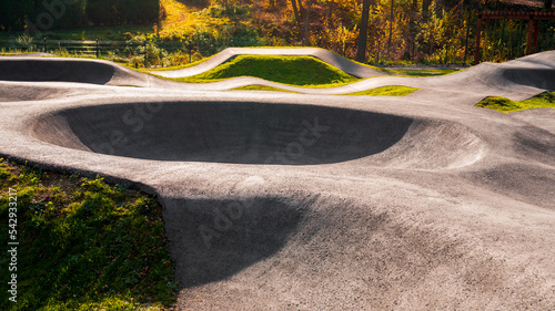 Outdoor bicycle asphalt pumptrack surrounded by nature in Polanka Wielka, Poland.
