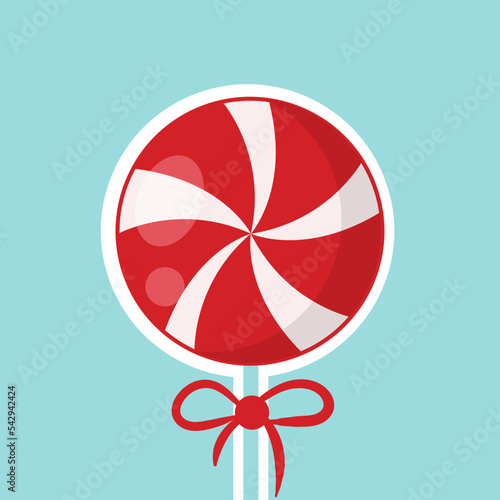 Round red and white lollipop. Christmas lollipop with a red bow on a blue background in flat style. Vector illustration.