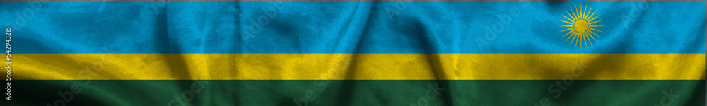 Elongated national flag of Rwanda, with a fabric texture fluttering in the wind. Republic of Rwanda flag for website design. 3d illustration