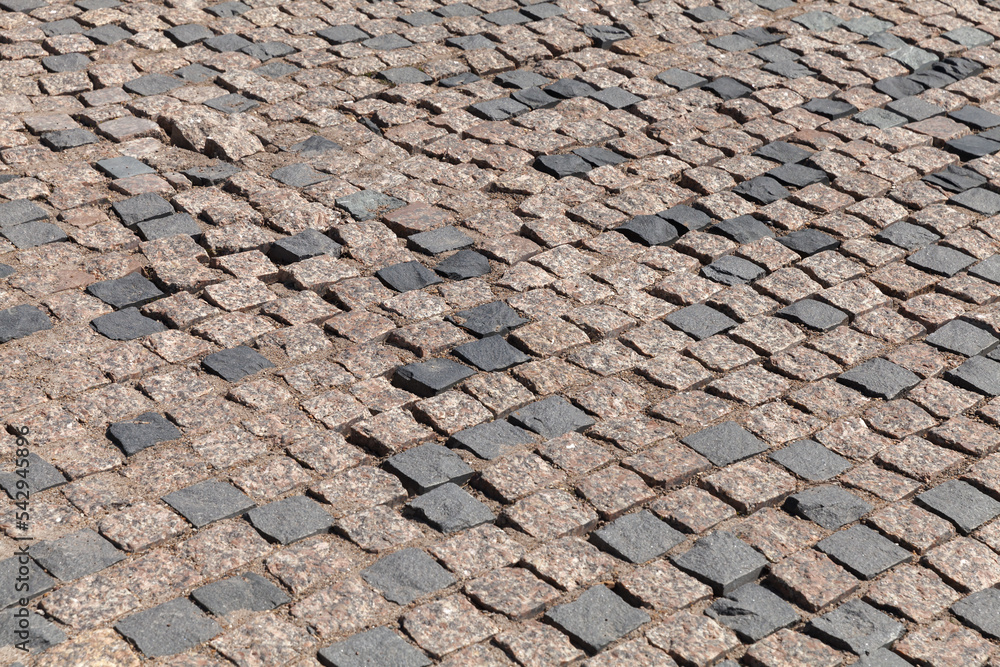 Old street pavement made of square stone blocks Old street pavement made of square stone blocks