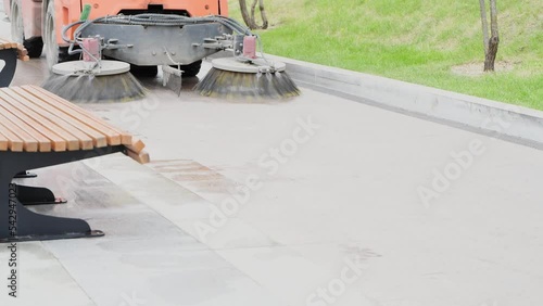 Machine washing and cleaning asphalt outdoor in the street. Street cleaning equipment. Public service