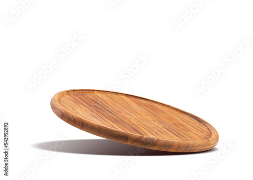 Round wooden pizza board falling on a white background. Food preparation. Culinary background.
