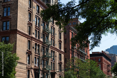 Wallpaper Mural Row of Old Brick Apartment Buildings with Fire Escapes along a Street on the Upper West Side of New York City Torontodigital.ca