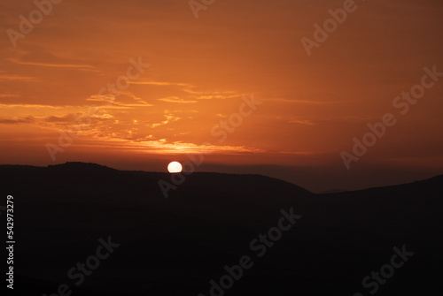 Sunset over the silhouette of the hills