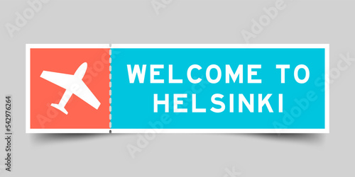 Orange and blue color ticket with plane icon and word welcome to helsinki on gray background