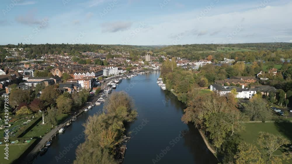 Aerial view along the River Thames at Henley-on-Thames, Oxfordshire, England in Autumn. Aerial view along the River Thames at Henley-on-Thames, Oxfordshire, England in Autumn.