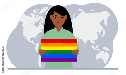 A woman holds an lgbt flag in his hands against the backdrop of a world map.