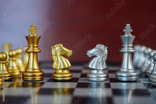 business strategy brainstorming chess board game with gray background