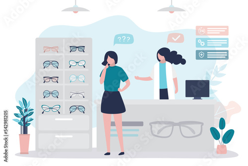 Woman chooses sunglasses. Female consumer stands in front of counter with goods and chooses eyeglass for purchase. Optometrist shelping client. Fashion optics store.