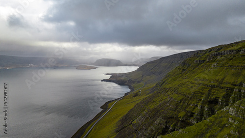 icelandic landscape with bay and mountain with clouds aerial view