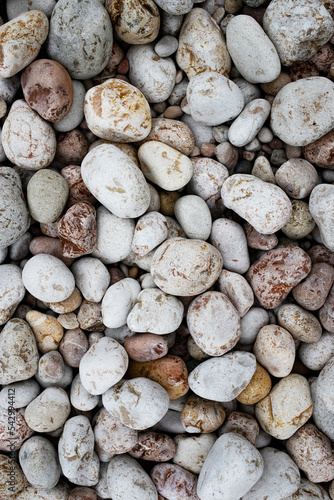 Natural background. Stones close-up, top view. Vertical image.