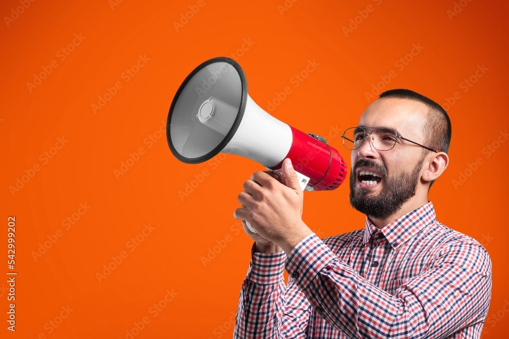 Young man hold megaphone and scream Young man hold megaphone and scream