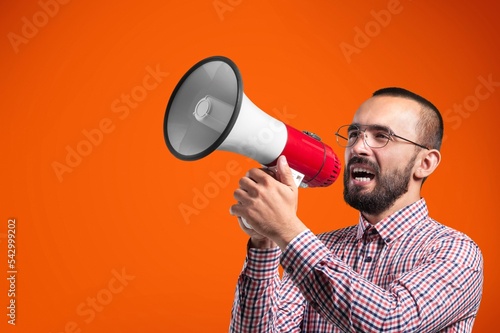Young man hold megaphone and scream