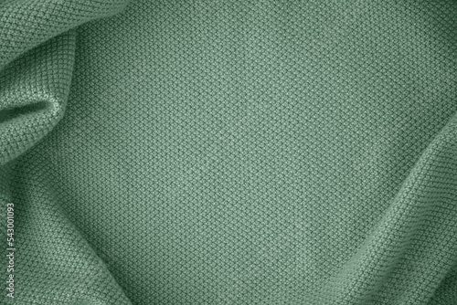 Texture of knitted fabric in trendy turquoise mint color