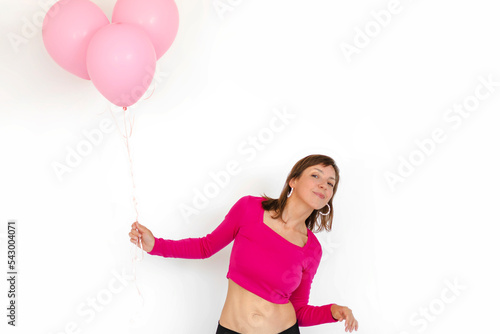 Woman with pink balloons on white background