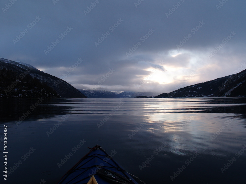With a kayak on the ocean in Norway with Mountains and Clouds, Scandinavian view