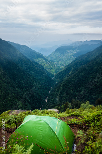 July 14th 2022, Himachal Pradesh India. Tents and camps with beautiful landscapes, valley and mountains in the background. Shrikhand Mahadev Kailash Yatra in the Himalayas.