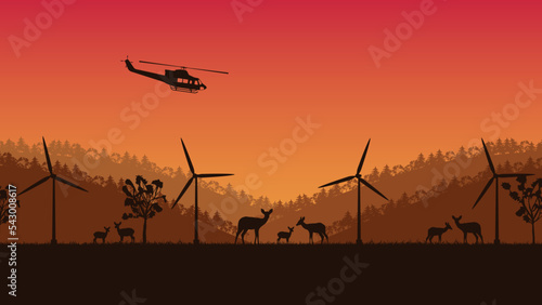 silhouette of deer animal and wind turbine on orange gradient background
