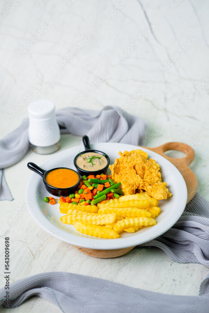 Beef steak served with two variant sauces, potato and vegetables. white background. brazilian typical food. variety angles Beef steak served with two variant sauces, potato and vegetables. white background. brazilian typical food. variety angles