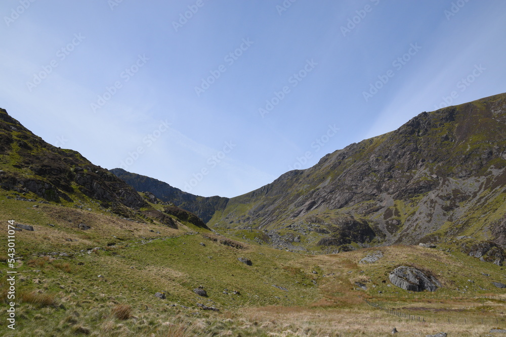 Fototapeta premium a view looing down in the crater of Cadair Idris with a mountain view behind it
