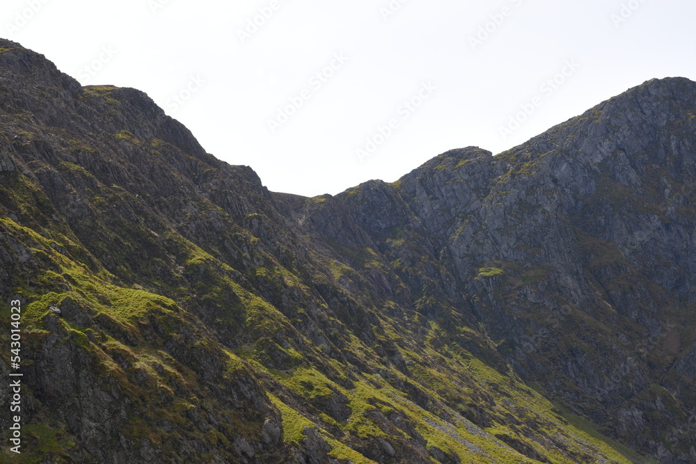 Fototapeta premium a view looing down in the crater of Cadair Idris with a mountain view behind it