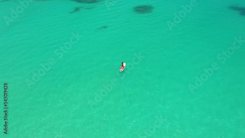 SUP Surfing Caribbean. Stand up paddle. Hoe he'e nalu, The woman floating on a SUP photo
