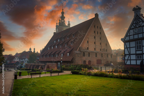 The building of the Great Mill byn the Radunia River in Gdansk at sunrise. Poland photo