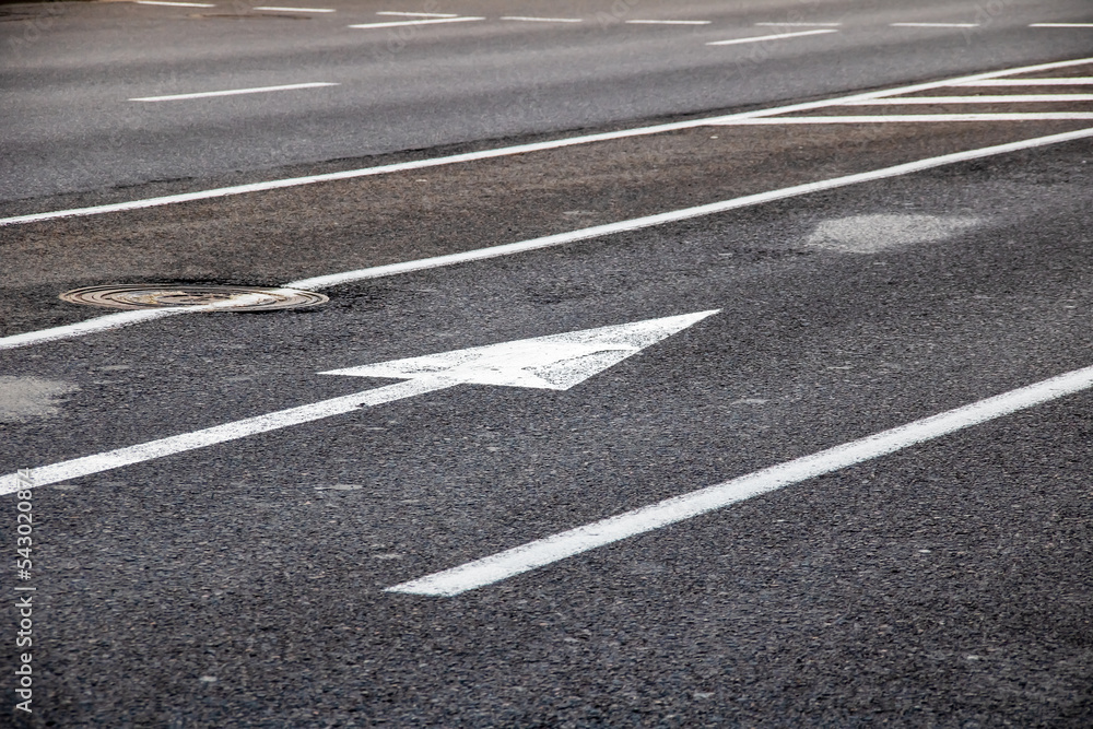 Arrows on the asphalt on the road markings