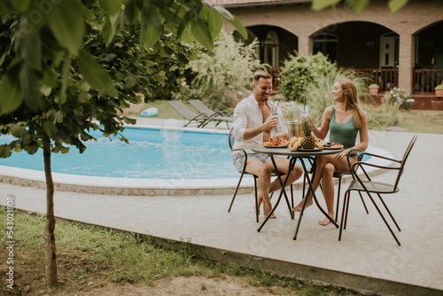 Young couple sitting in the...