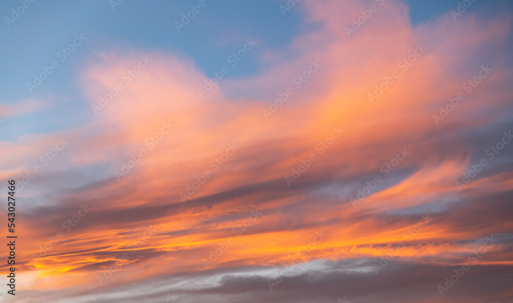 Beautiful bright  orange sunset sky with clouds. Sunset sky background.