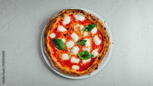 Top view of a pizza Margherita on a table photo