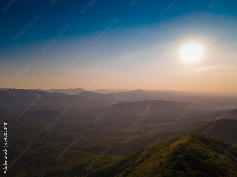 Mountain summer sunset. Flying device with camera Mountain summer sunset. Flying device with camera