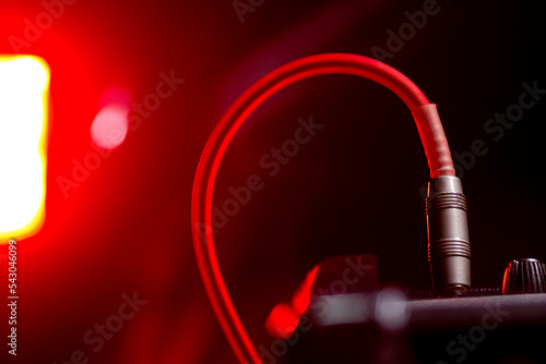 jack cable plugged into amp for concert prep and backstage setup