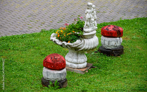 marble statues in a garden in a village in Italy